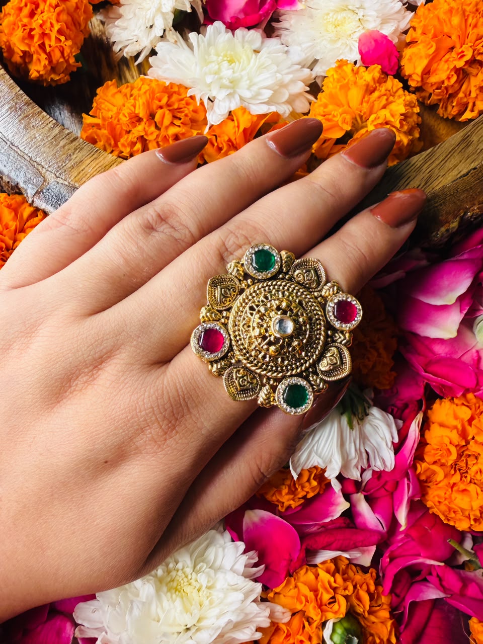 Antique gold temple ring with red green and clear stones