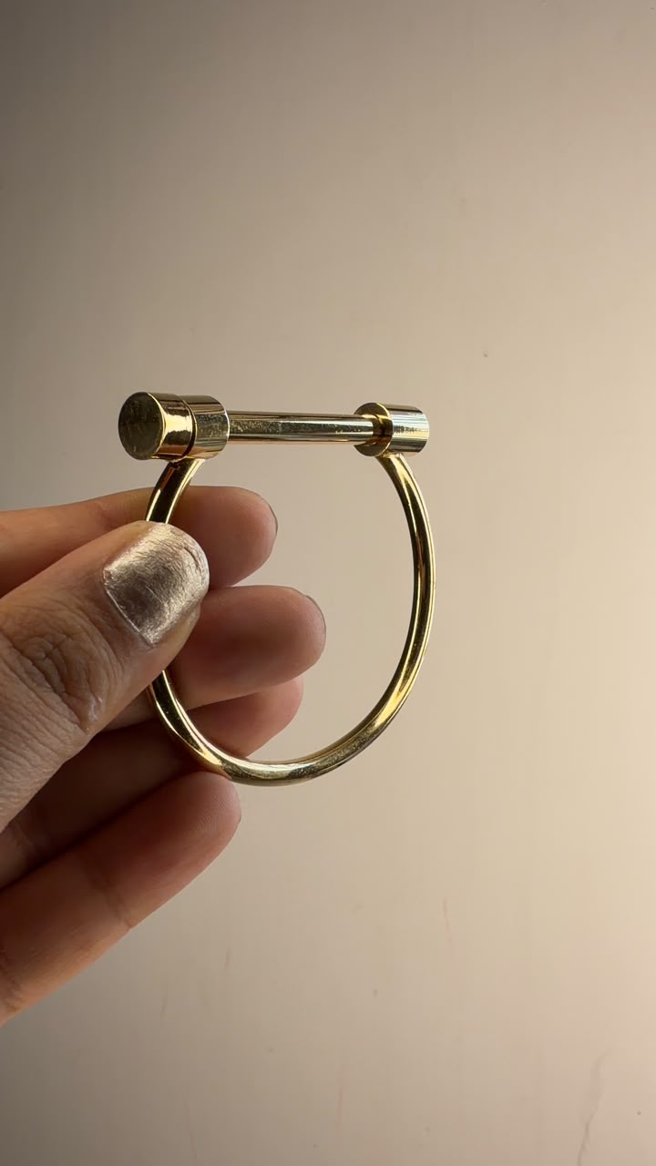 Minimal polished gold tone open bar bangle bracelet
