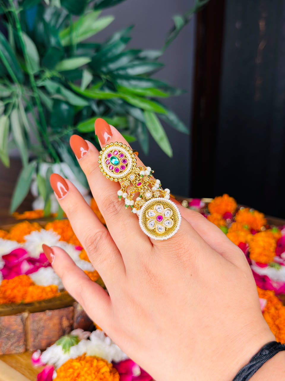 Traditional gold tone double disc statement ring with multicolor stones and pearl details