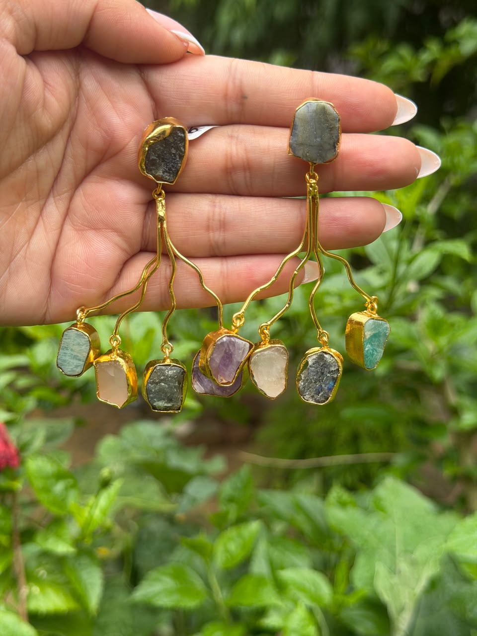 Gold tone long branch drop earrings with raw multicolor gemstones