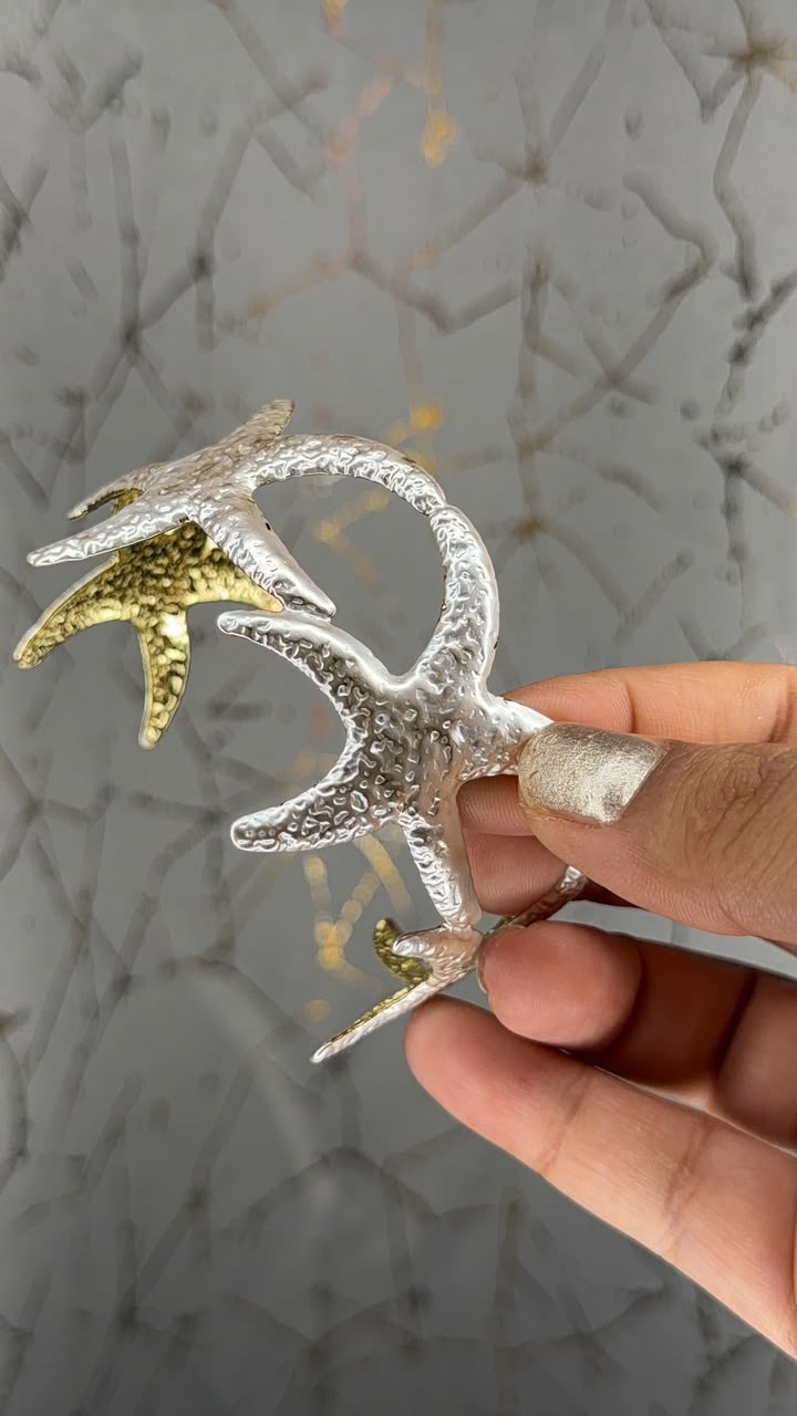 Silver and gold tone sculptural starfish cuff bracelet